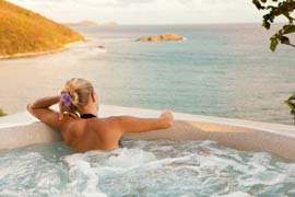 Woman relaxing in spa at Caribbean villa med